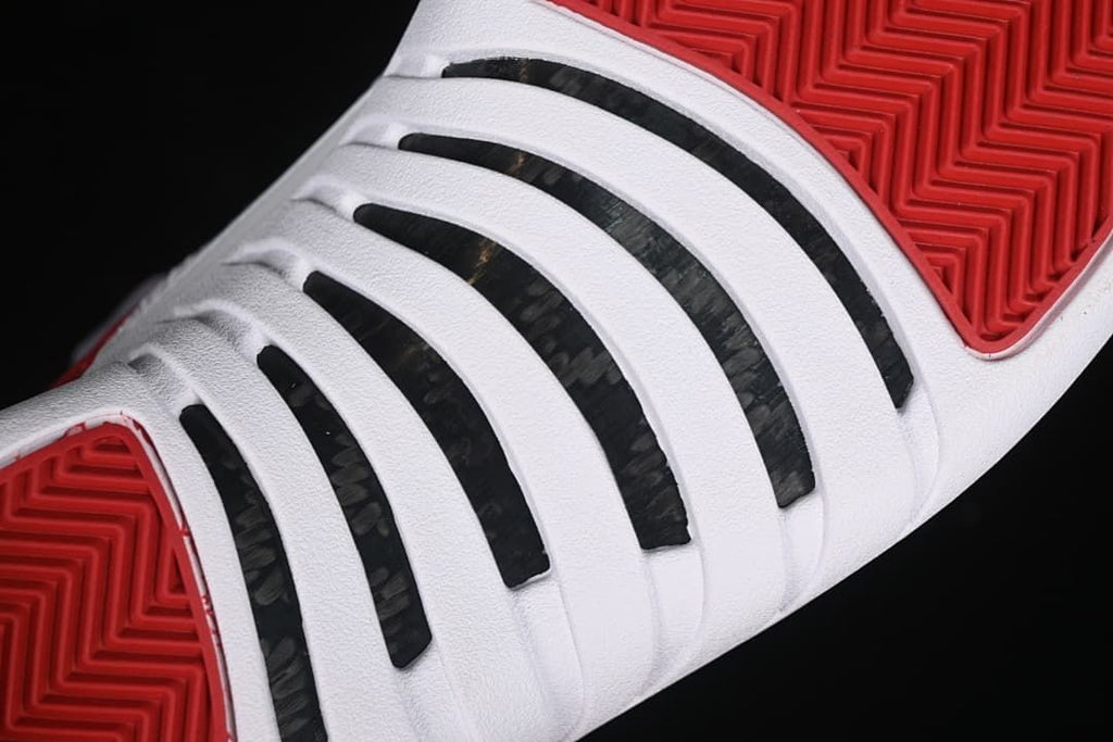 Close-up of the white midsole and red outsole tread