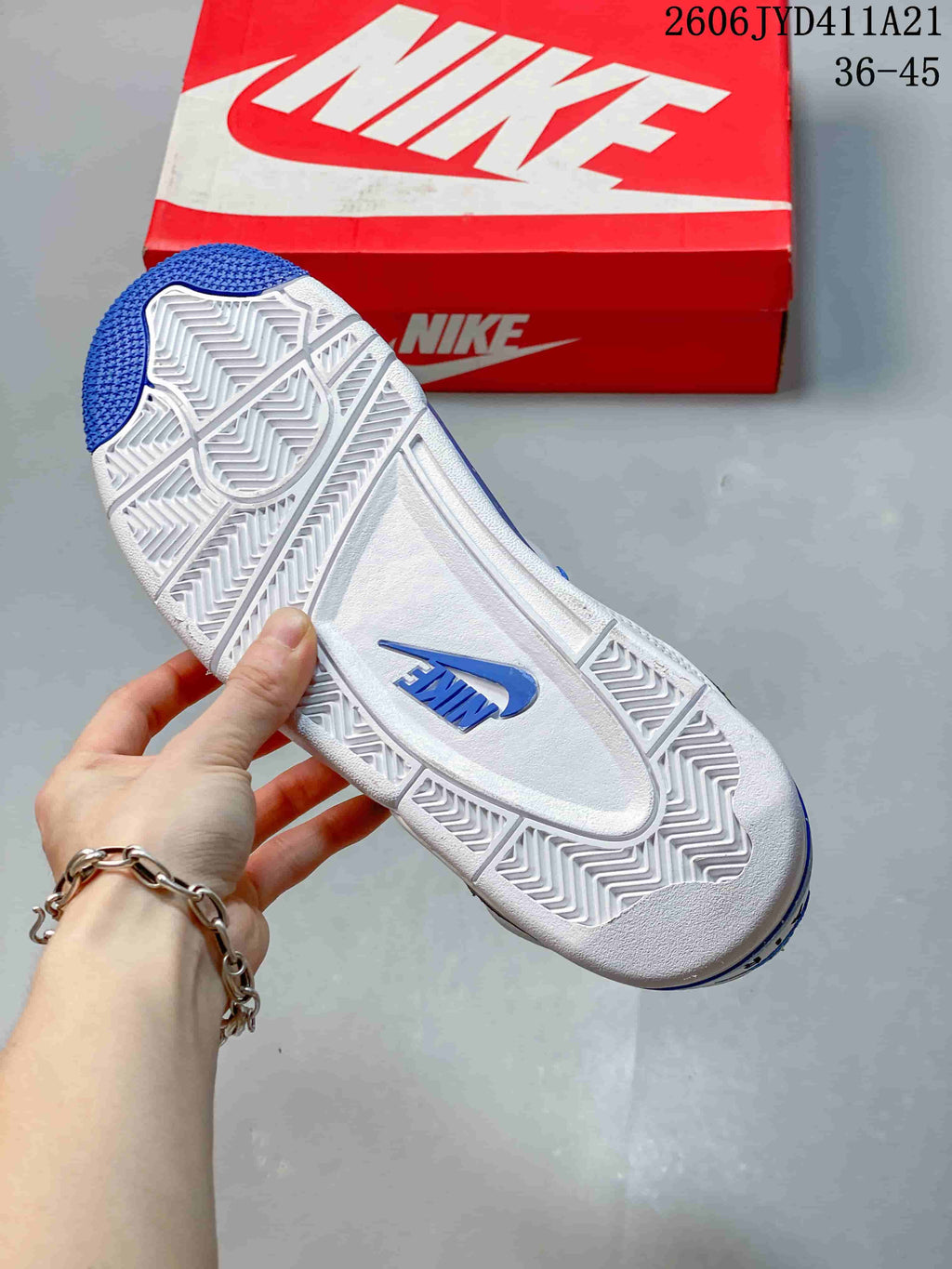 Close-up of the patterned outsole with blue accents