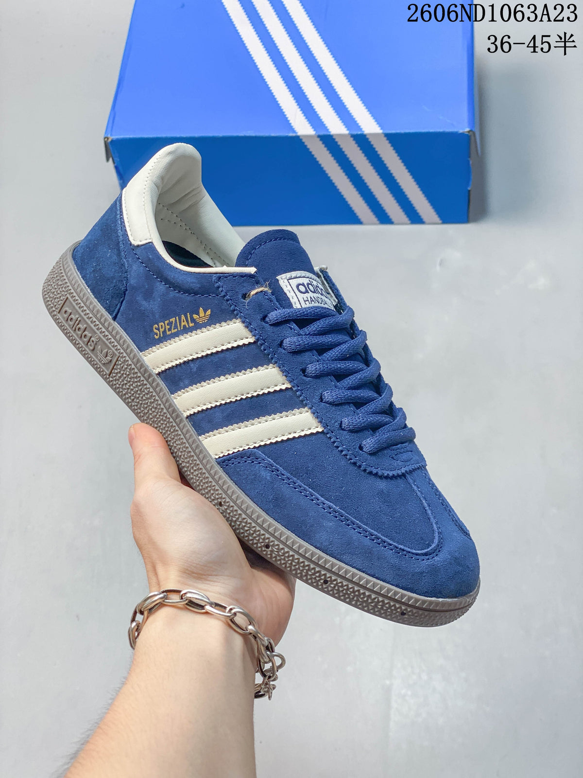 Blue Adidas Spezial low-top sneaker with light stripes and a dark sole.