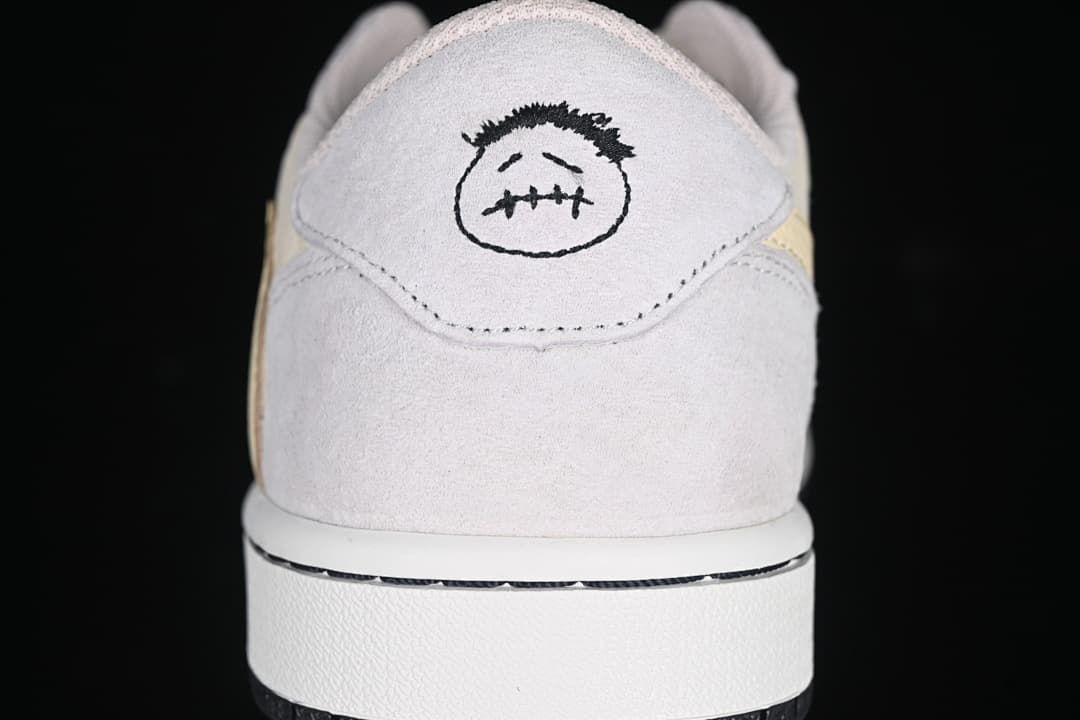 Heel view showing embroidered graphic on the sneaker