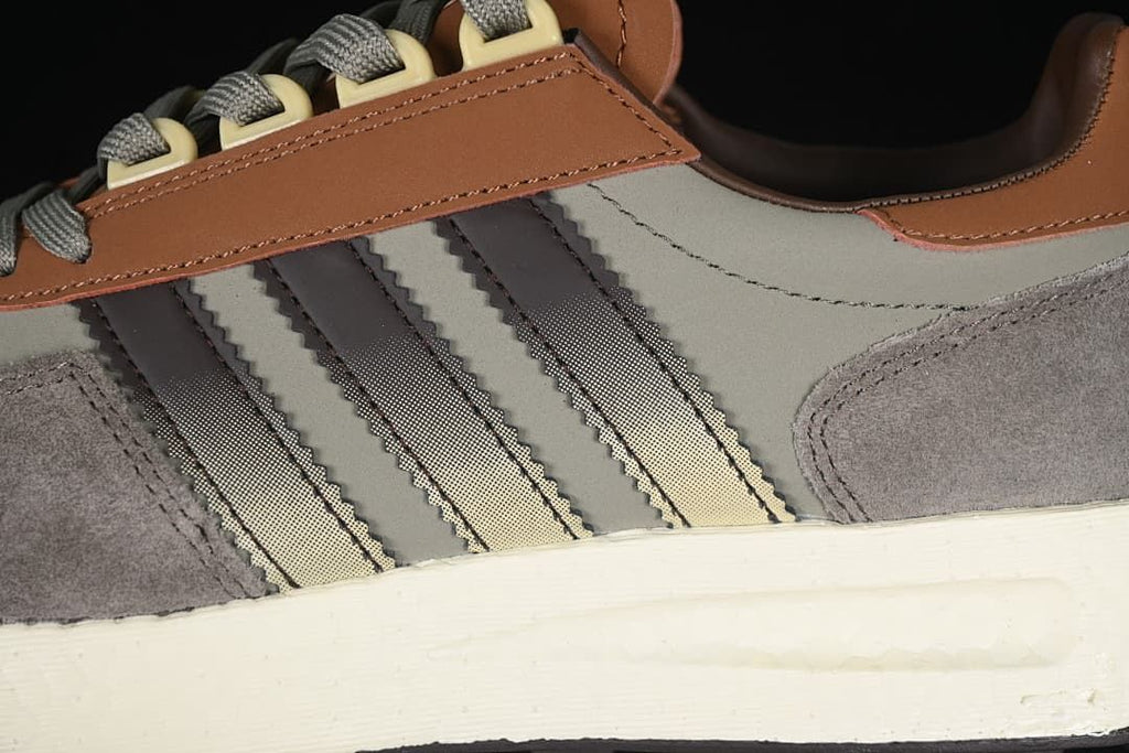 Close-up of the three side stripes, layered panels, and midsole