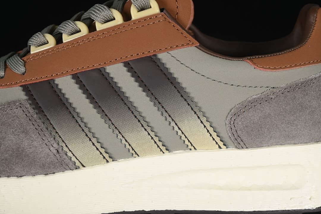Close-up of the three side stripes, layered panels, and midsole