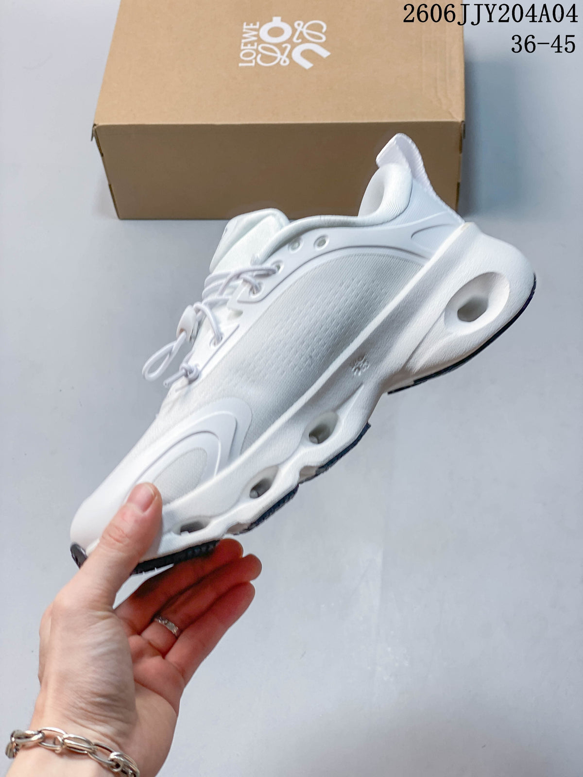 Side view of a white sneaker showing its sculpted sole