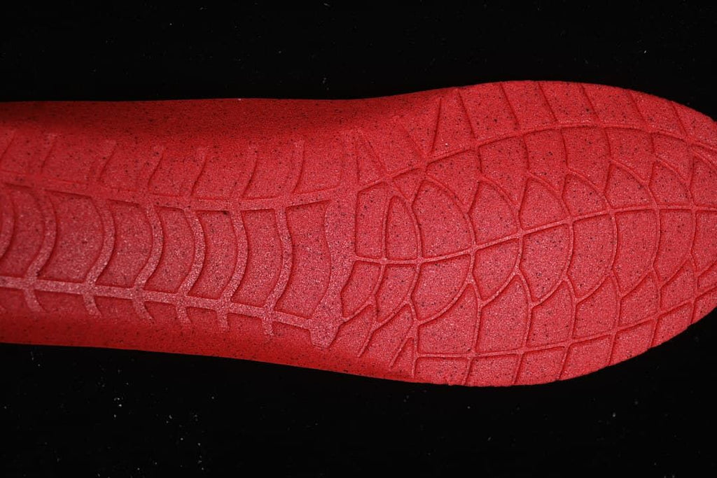 Close-up of the sneaker's red outsole tread