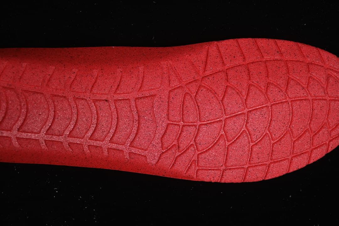 Close-up of the sneaker's red outsole tread