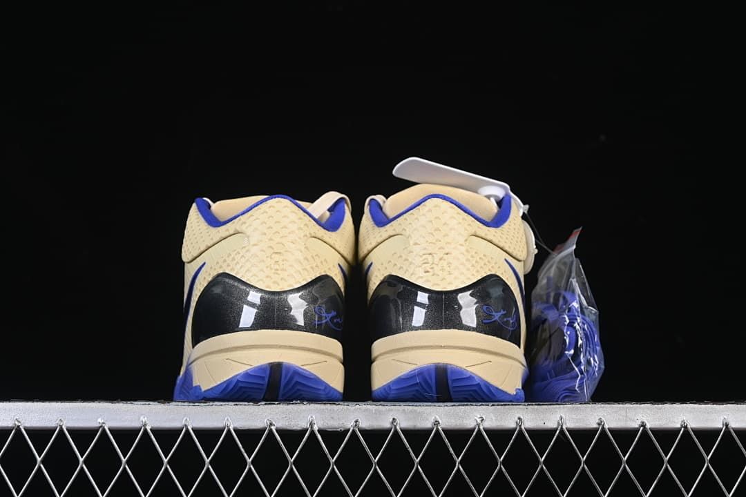 Rear view of both shoes with blue outsole details.