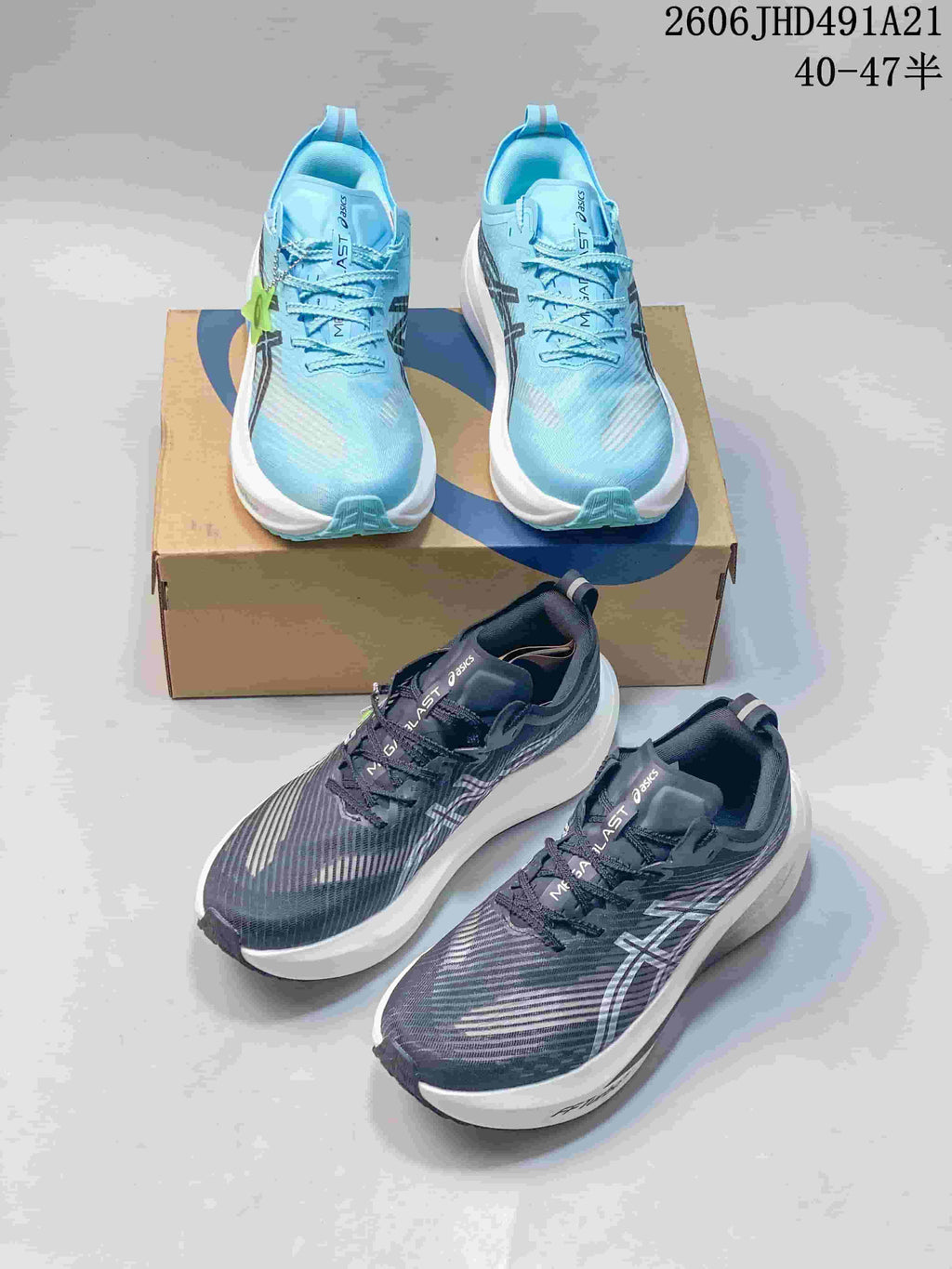 Light blue and charcoal ASICS MEGABLAST running shoes shown together