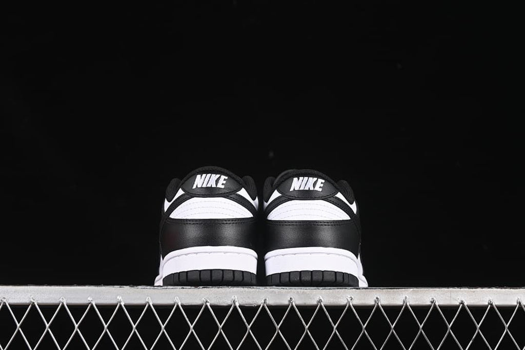Rear view of both sneakers showing black heel panels