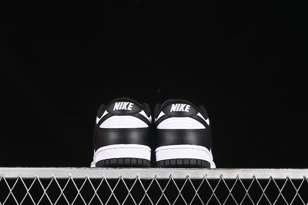 Rear view of both sneakers showing black heel panels