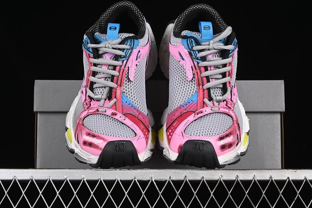 Front view of the pair showing grey laces and multicolor detailing