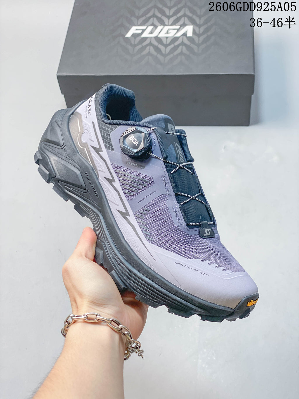 Side view highlighting the shoe's dial-adjustable lacing and lugged outsole