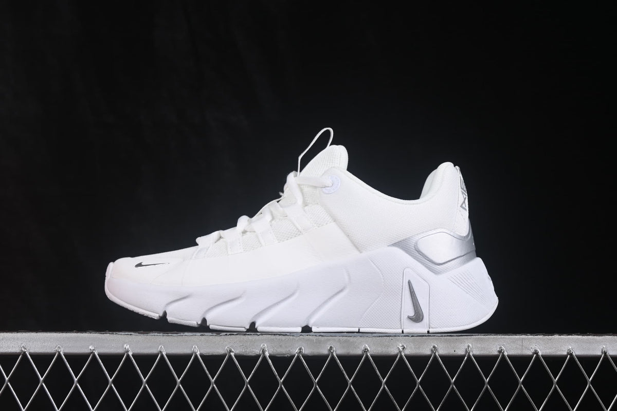 Side view showing the layered white sole, mesh upper, heel structure and Nike Swoosh details.