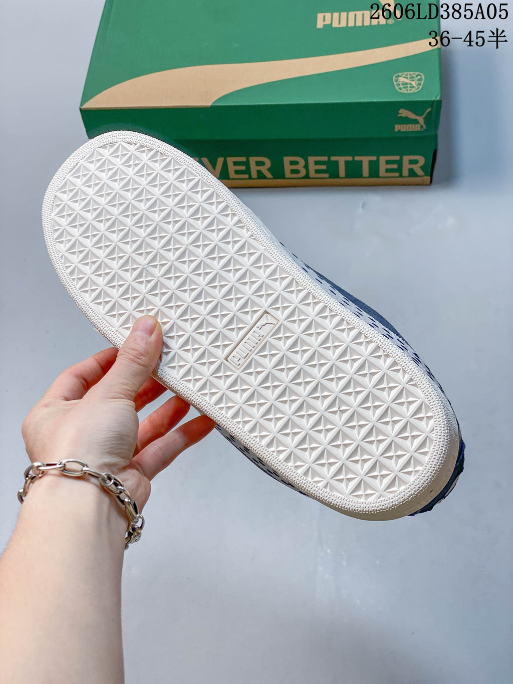 Close-up of the white textured outsole on a blue PUMA sneaker.