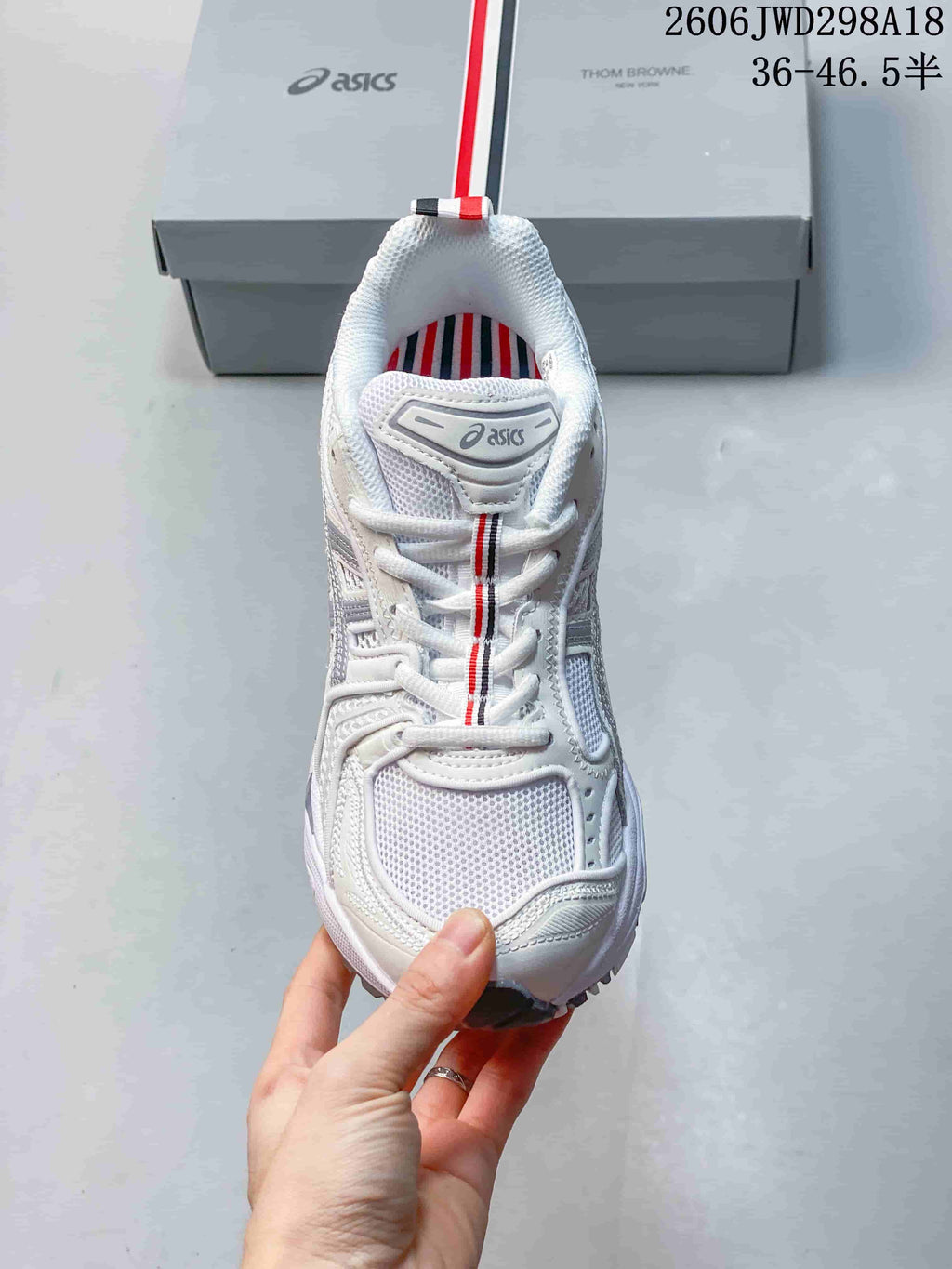 Top view of the ASICS GT-2160 sneaker showing its mesh panels and striped lace detail