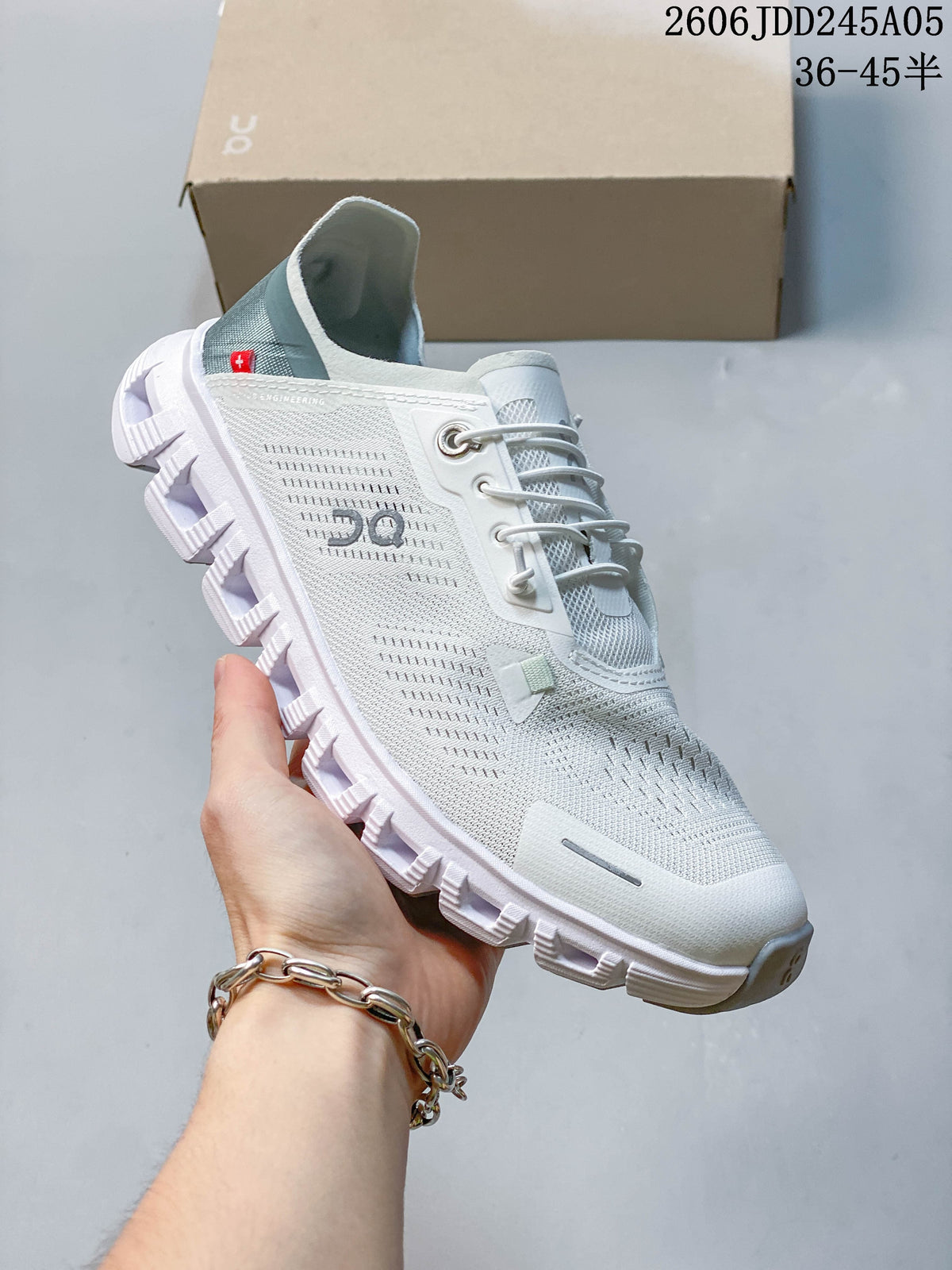 Side view of the white shoe showing its lace-up design and segmented outsole.