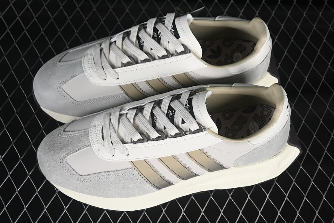 Pair of grey and white adidas Retropy E5 sneakers viewed from above