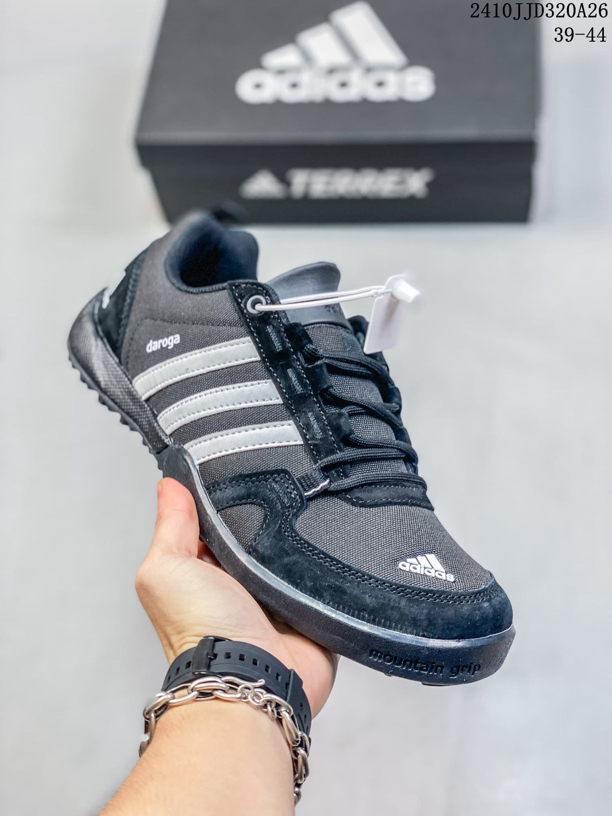 Angled side view of a charcoal adidas Daroga Plus shoe with three light-colored stripes; image overlay reads 39–44.