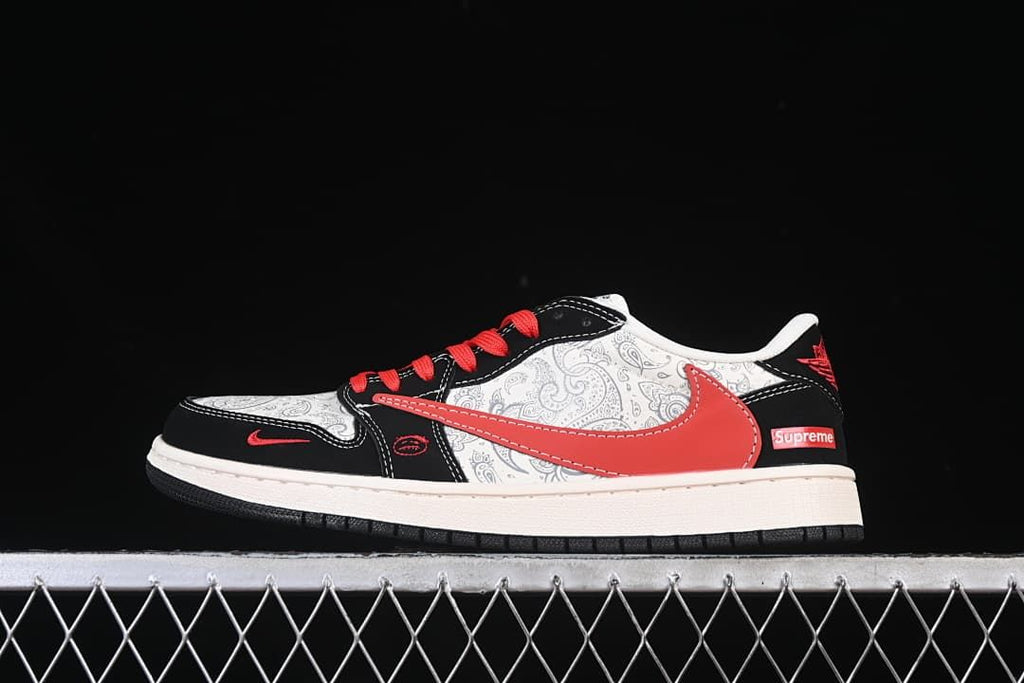 Side view of a low-top sneaker with a light paisley-patterned upper, black overlays, red Swoosh and red laces