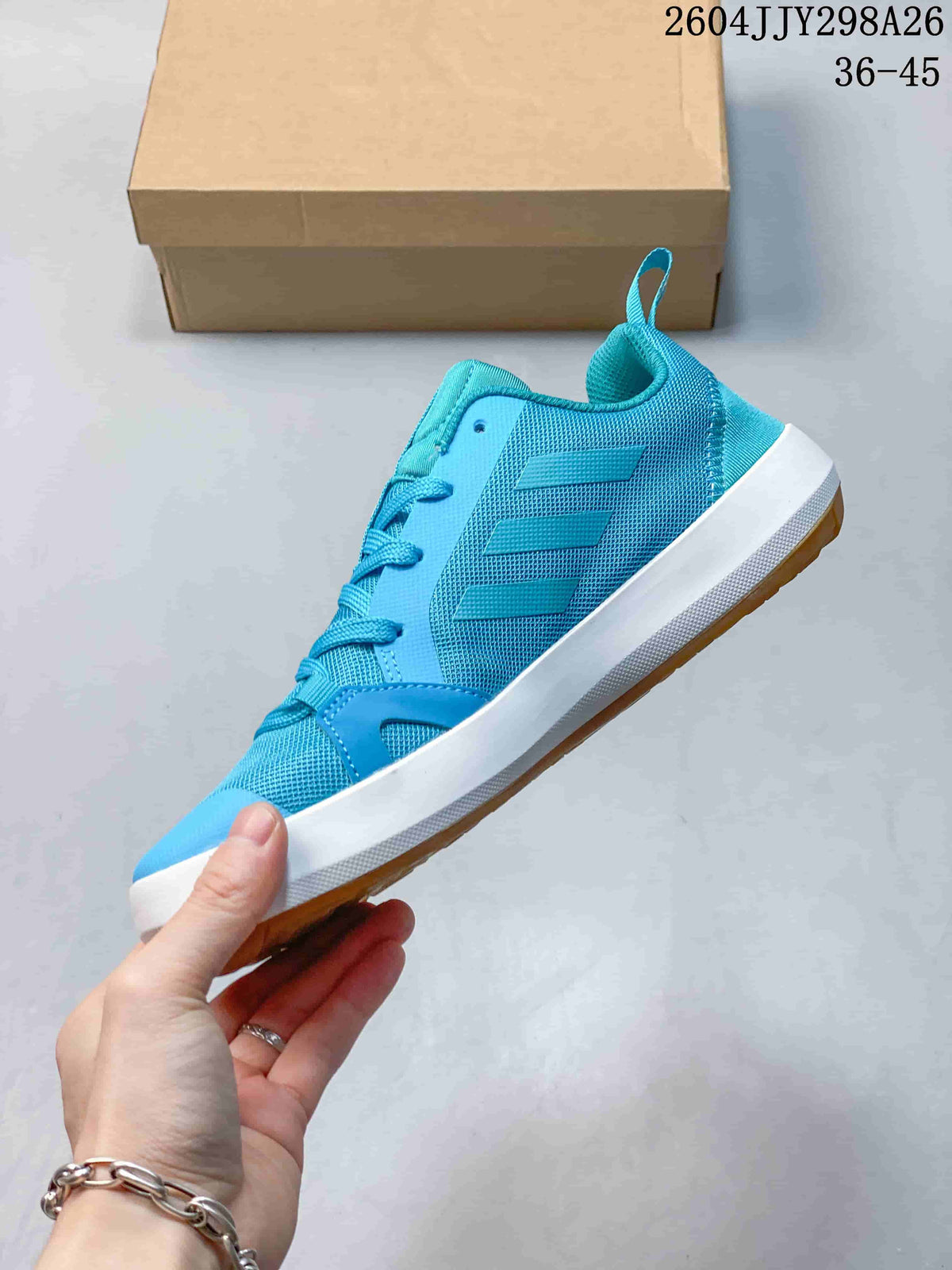Side profile showing the turquoise upper, three stripes, and gum outsole