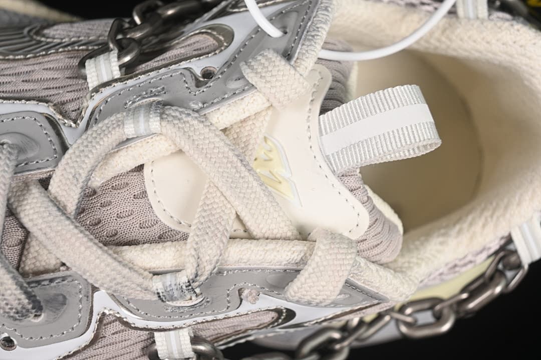 Close-up of the laces, tongue, and decorative upper details.