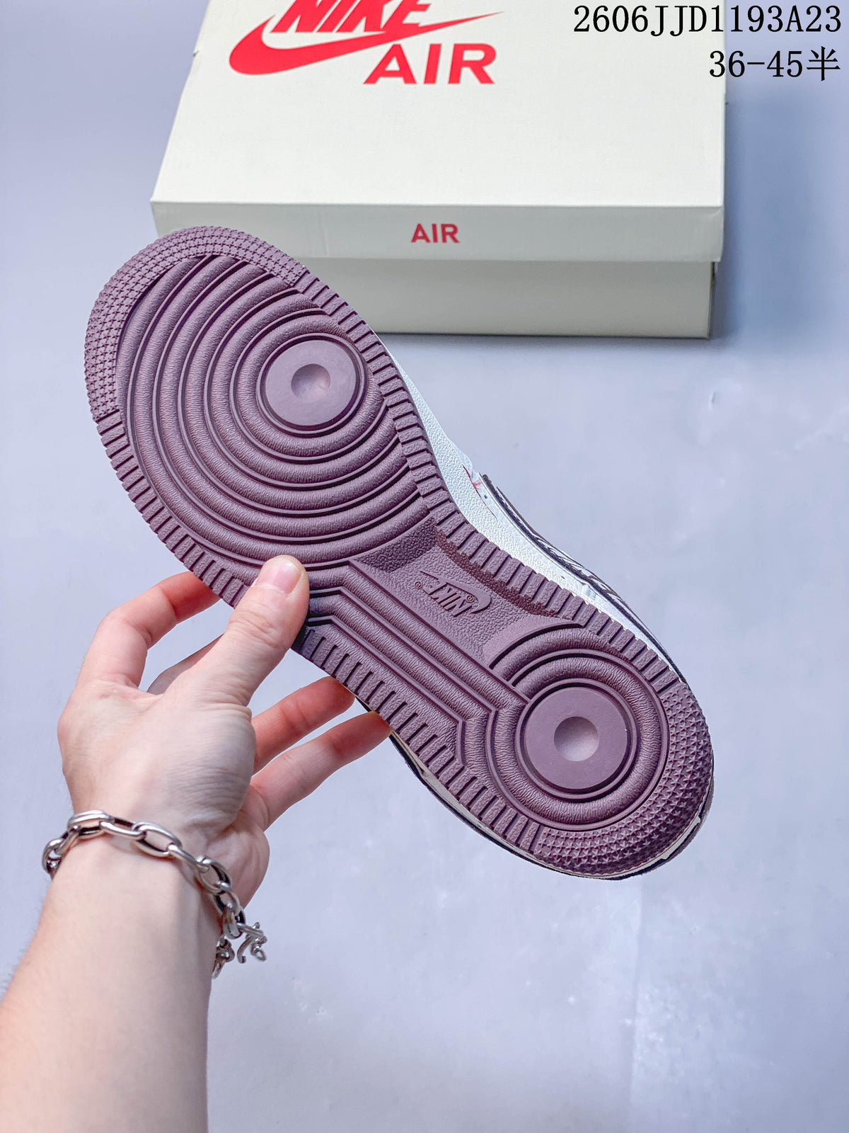 Close-up of the burgundy-colored outsole on the Nike Air Force 1