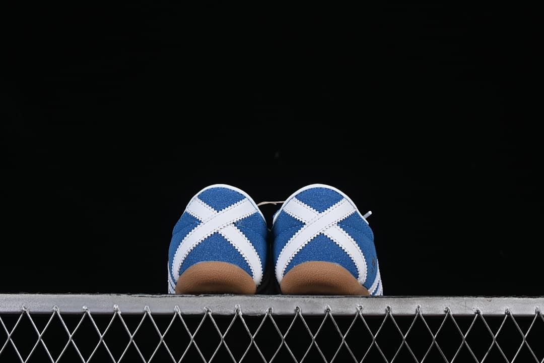 Rear view showing crossed white heel accents and gum-colored soles