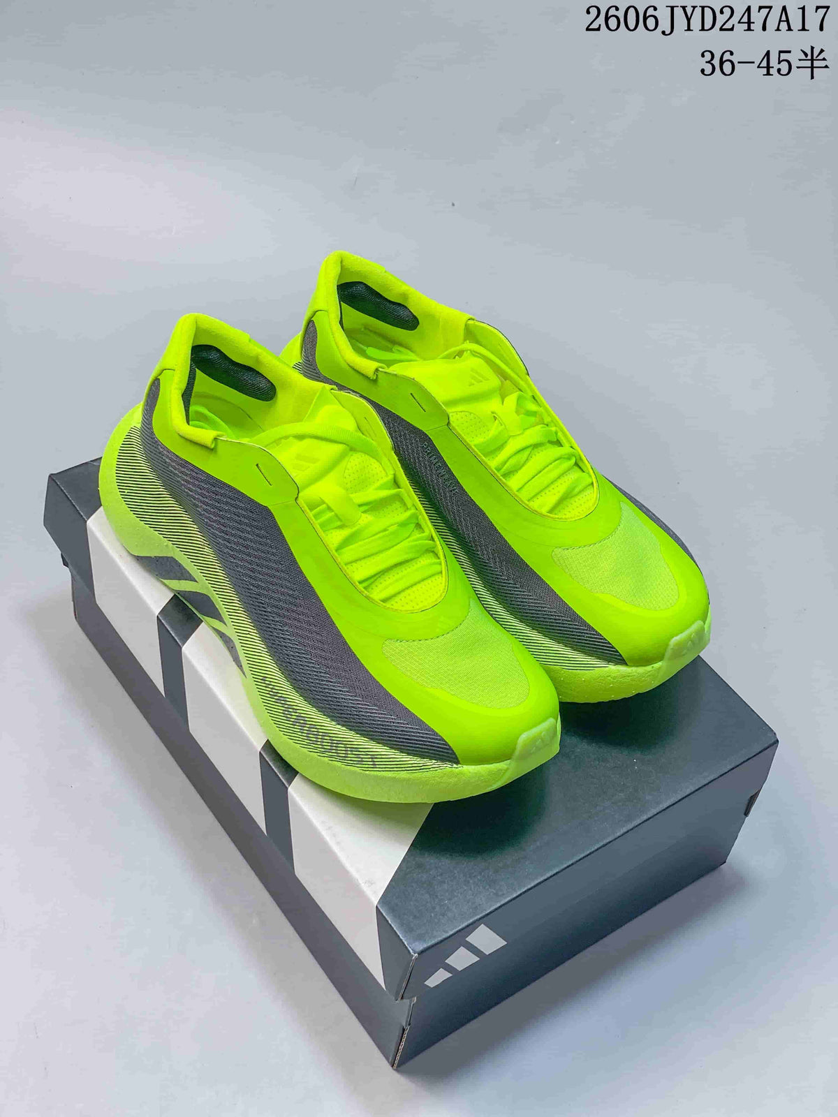 Pair of neon yellow and gray Adidas Hyperboost Edge M sneakers on a shoebox