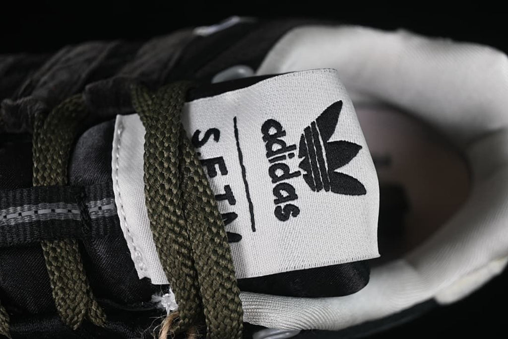 Close-up of the tongue label with adidas and SFTM markings.