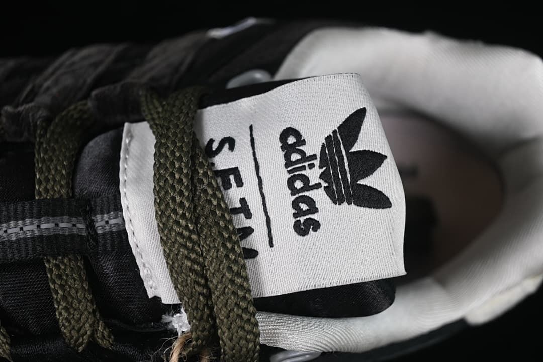 Close-up of the tongue label with adidas and SFTM markings.