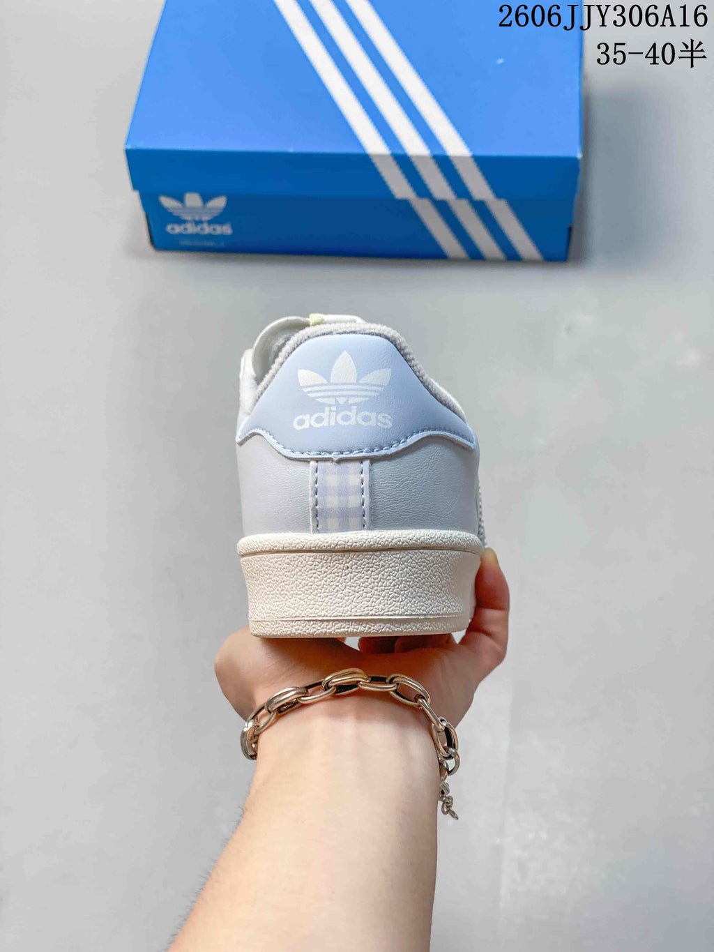 Rear view of the sneaker with pale blue heel detail