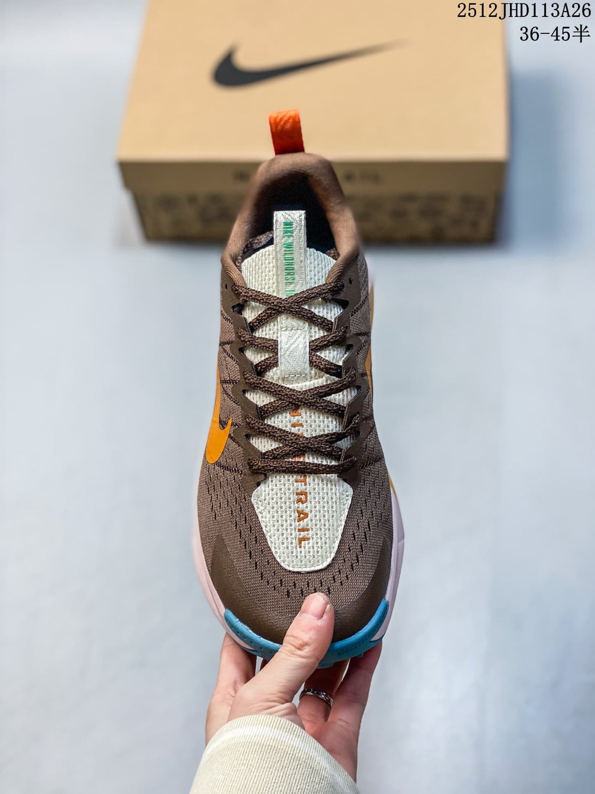 Top view of a brown Nike ReactX Wildhorse 10 showing its laces and light-colored tongue.