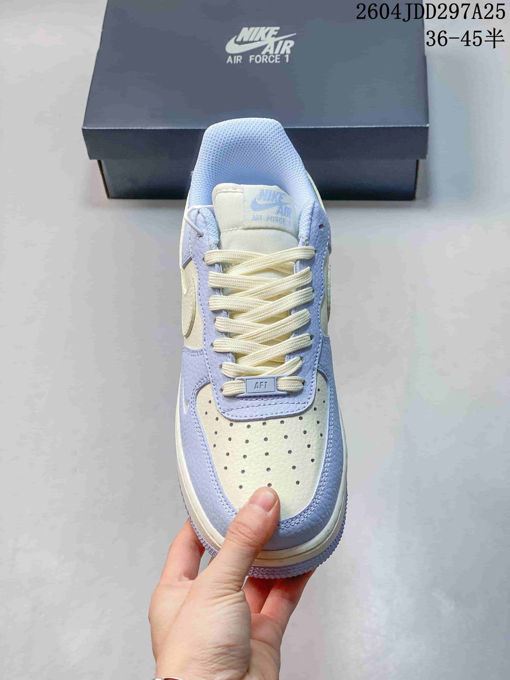 Top view of a low-top sneaker showing its perforated toe and laces