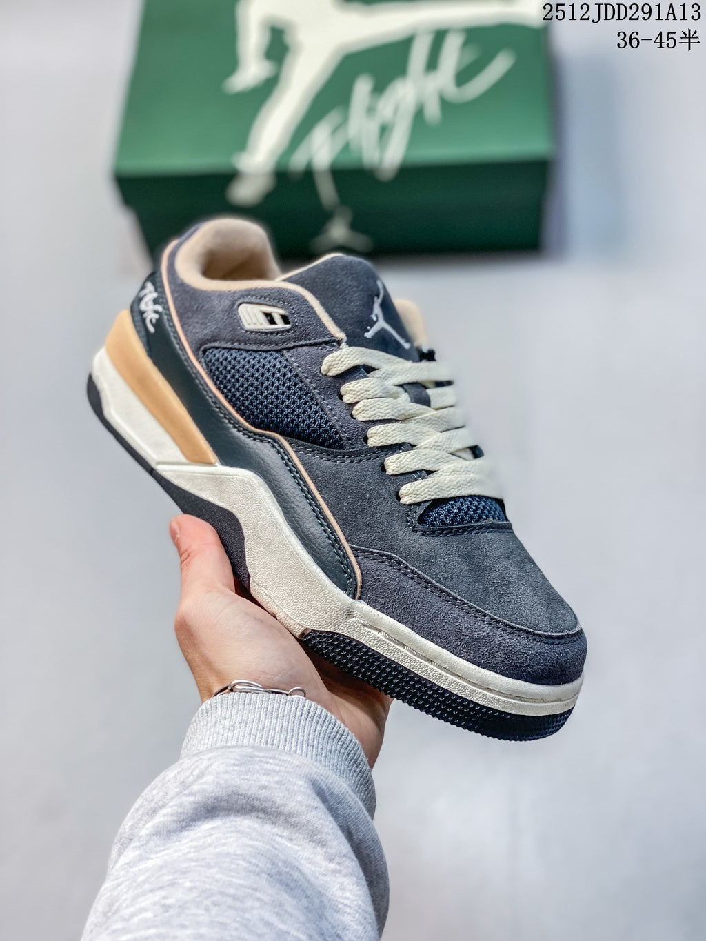 Angled side view of a charcoal and navy Jordan Flight Court ATE sneaker with mesh panels and cream and tan accents