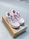 Pair of pale pink and white On Cloudtilt low-top shoes on a box