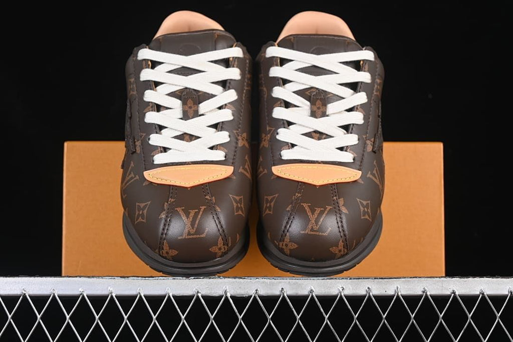 Front view of the pair showing the patterned toes and cream laces.