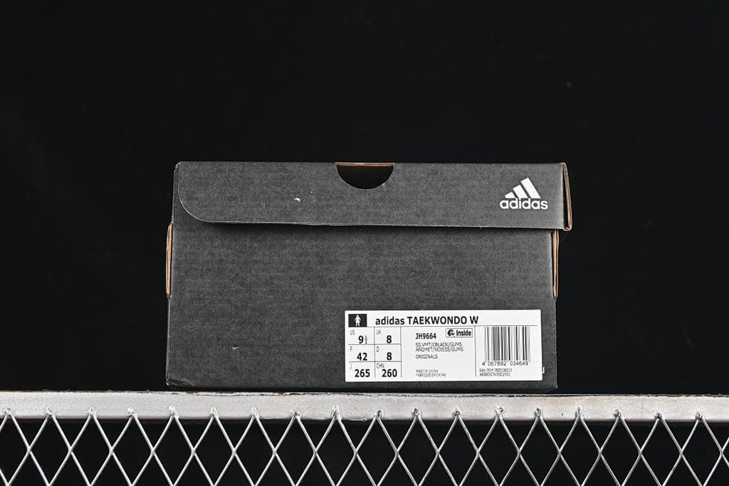 Shoe box label identifying adidas Taekwondo W, style JH9664, and sample size US 9.5, UK 8, EU 42.