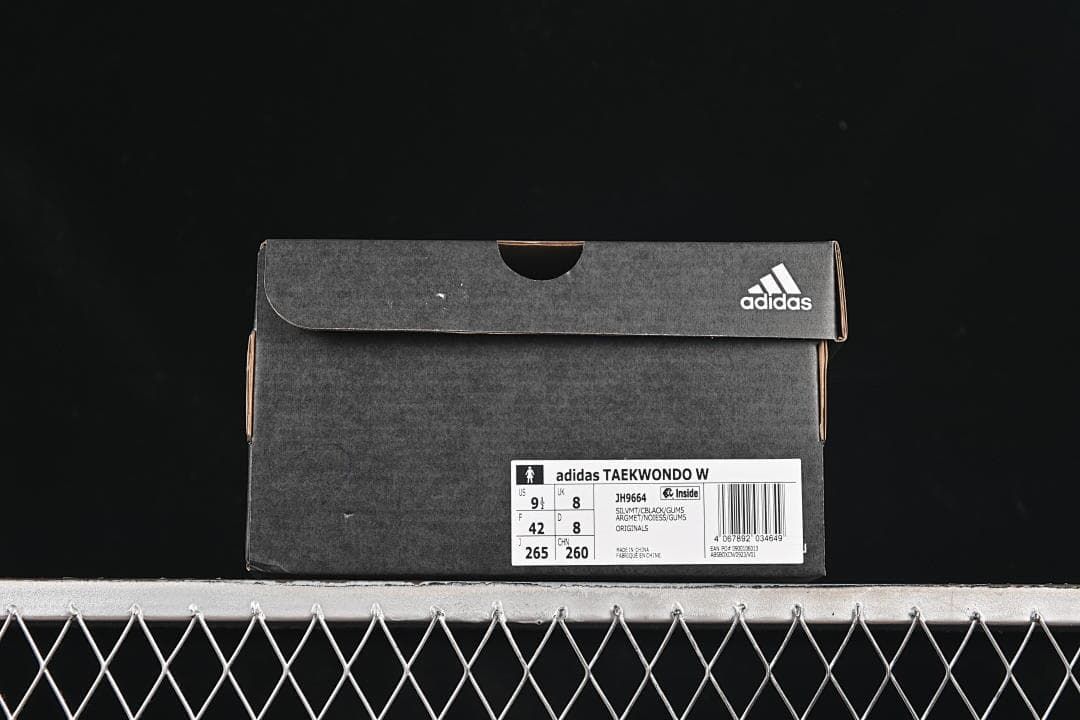 Shoe box label identifying adidas Taekwondo W, style JH9664, and sample size US 9.5, UK 8, EU 42.