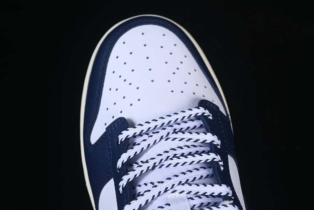Close-up of the perforated toe and navy-and-white laces