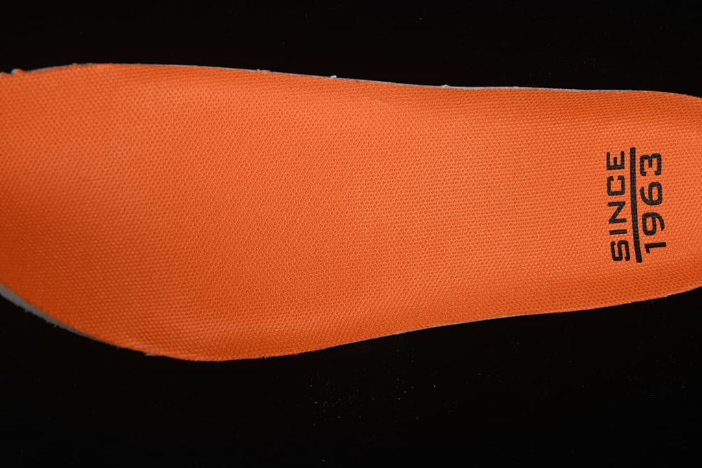 Close-up of the orange shoe insole marked ECCO Since 1963