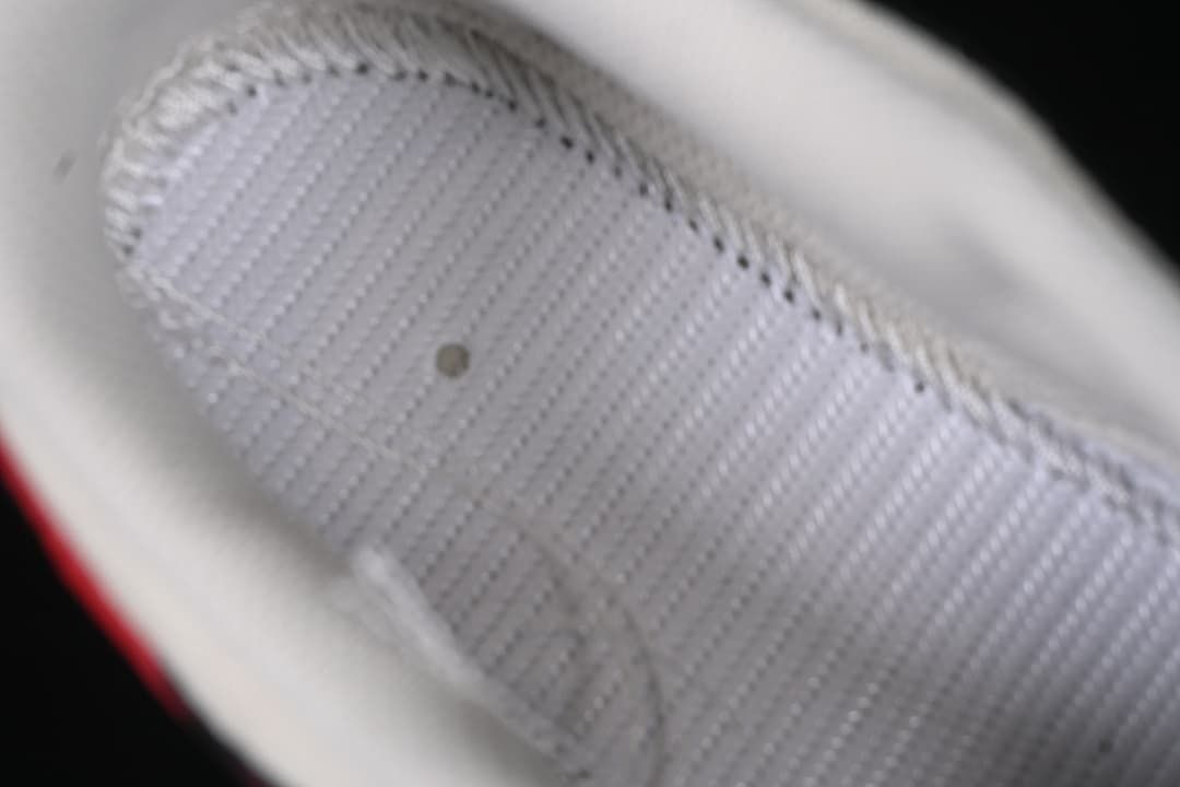 Close-up of the sneaker's white inner lining and stitching.