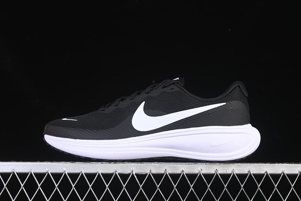 Side view of black Nike Revolution 8 running shoes with white Swoosh and white midsole