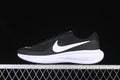 Side view of black Nike Revolution 8 running shoes with white Swoosh and white midsole