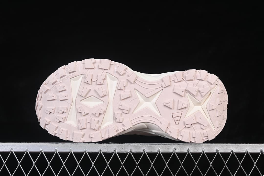 Underside view showing the pink outsole tread pattern