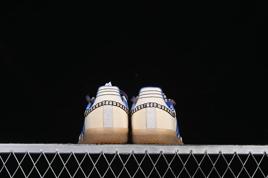 Rear view of both sneakers showing heel stitching and gum outsoles.