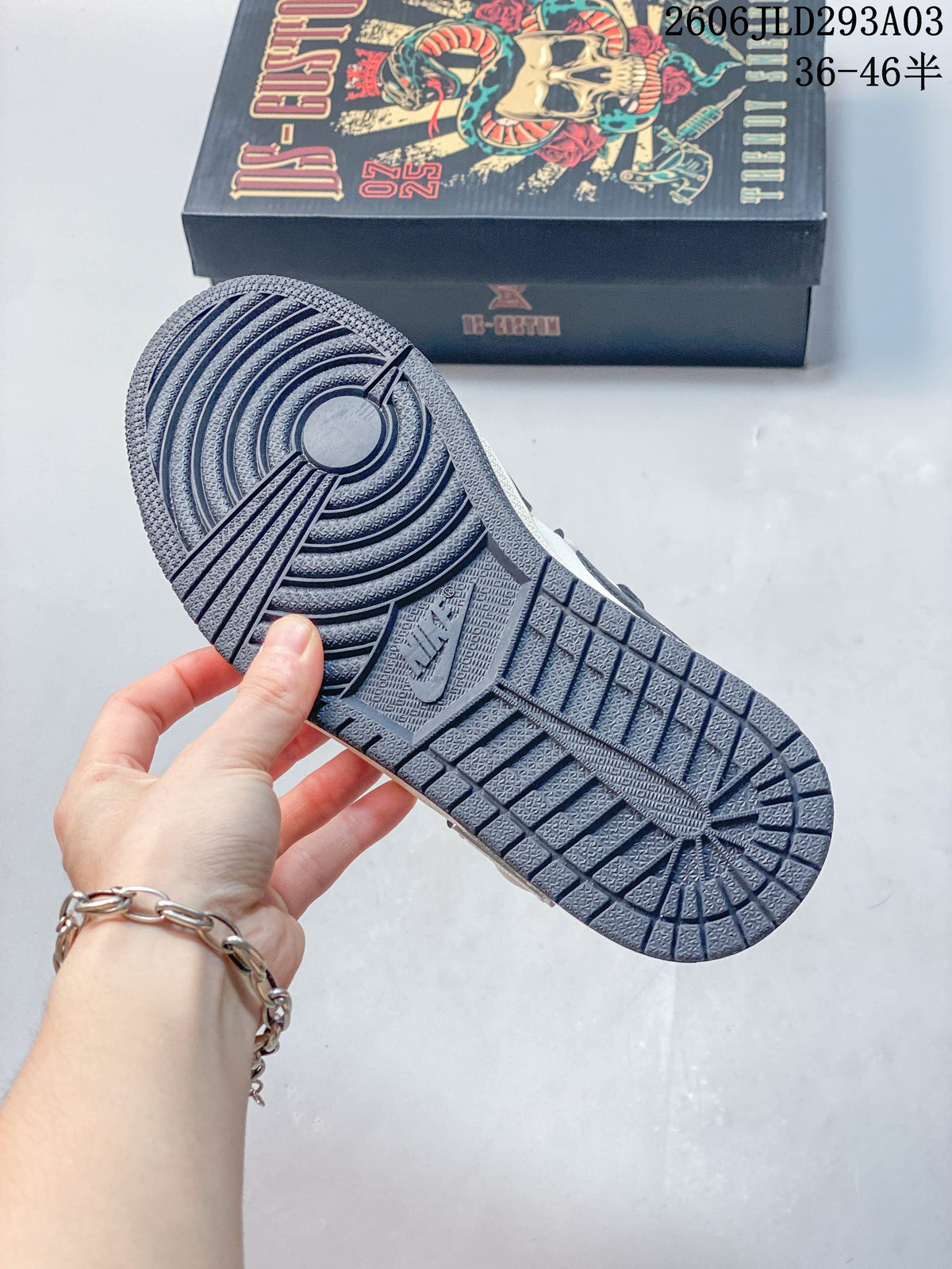 Close-up of the dark patterned outsole on the Jordan sneakers