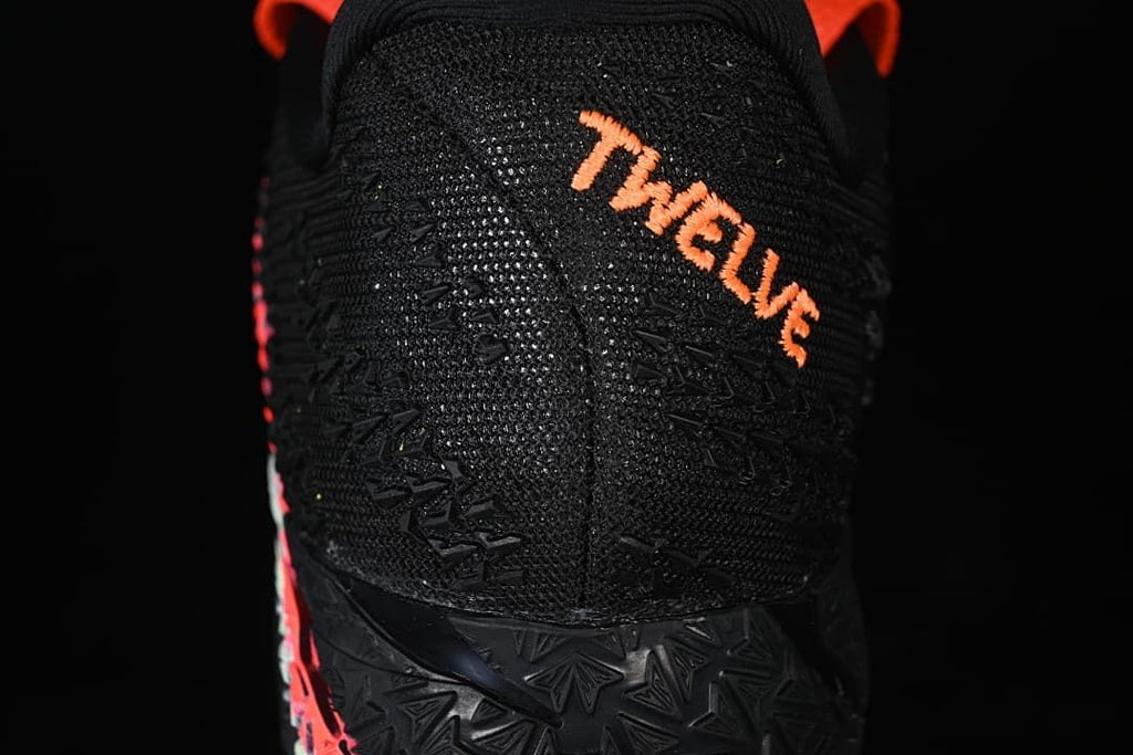 Close-up of the black heel with orange Ja-themed lettering.