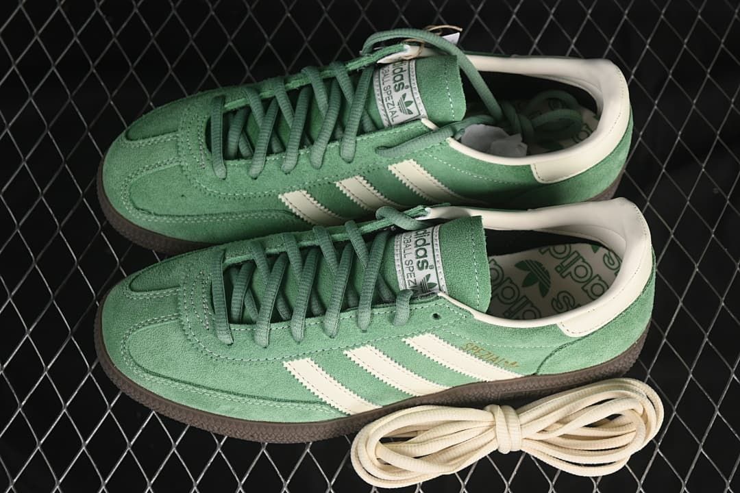 Pair of green Handball Spezial sneakers with an extra pair of cream laces