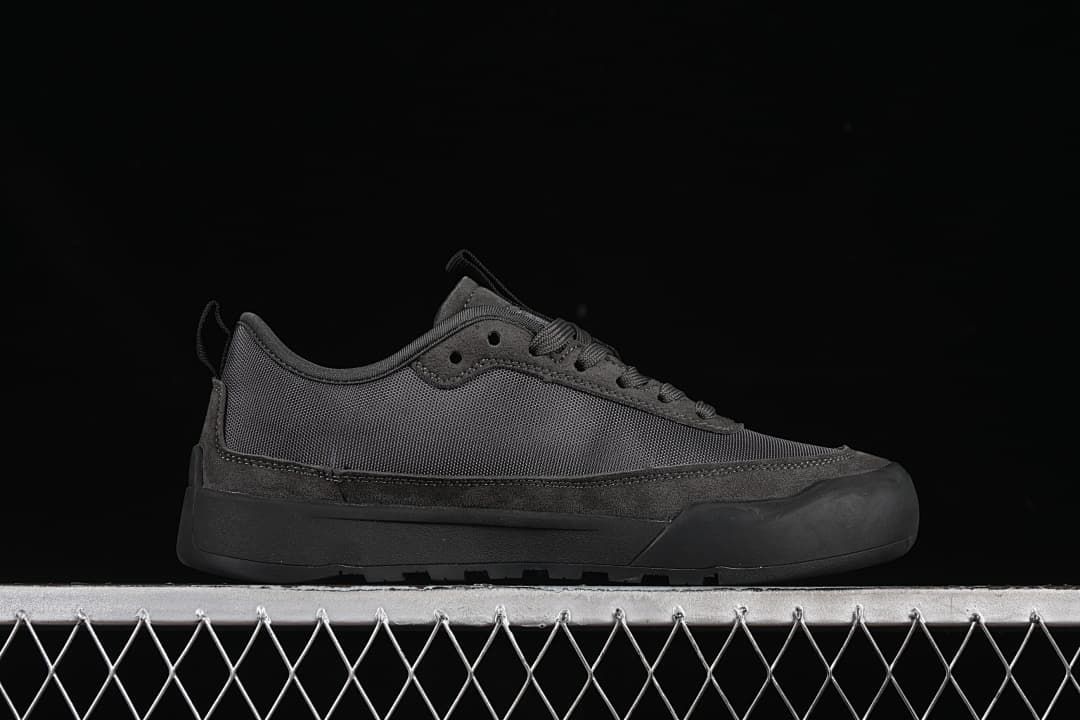 Side profile of a charcoal grey low-top sneaker