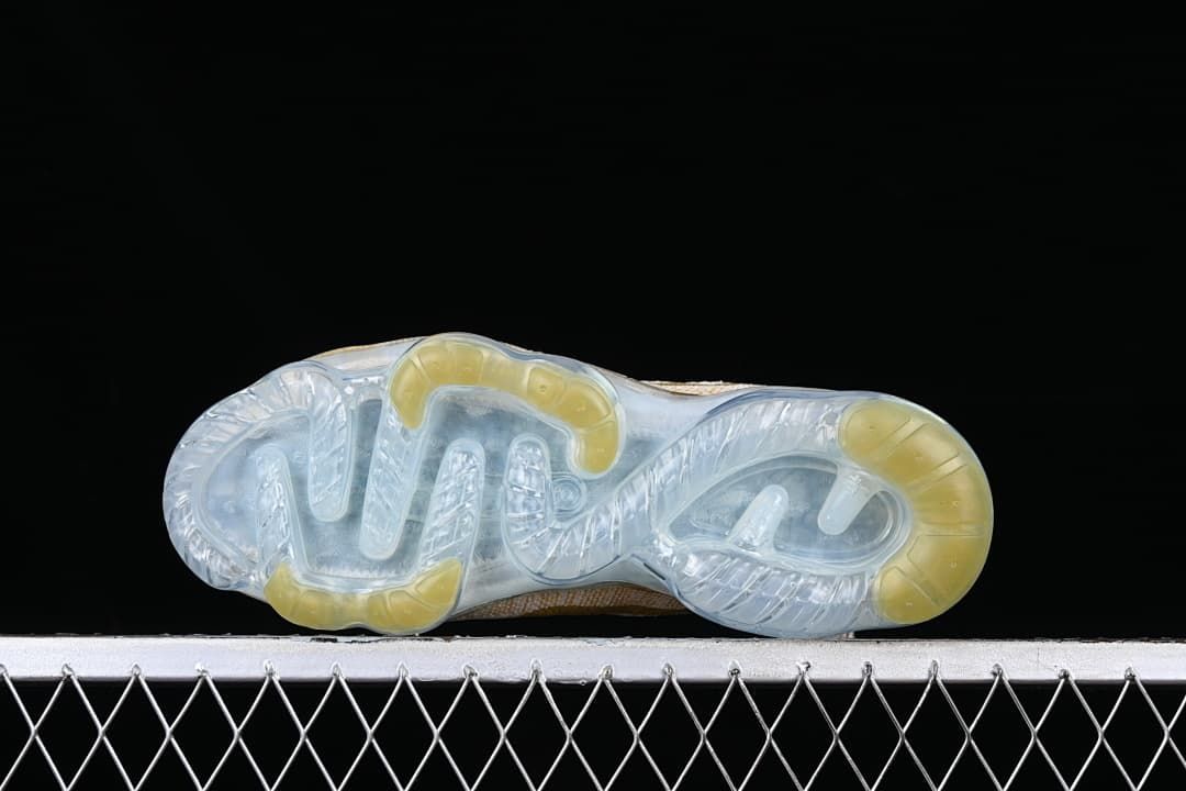 Underside view showing the clear outsole and pale yellow sections.