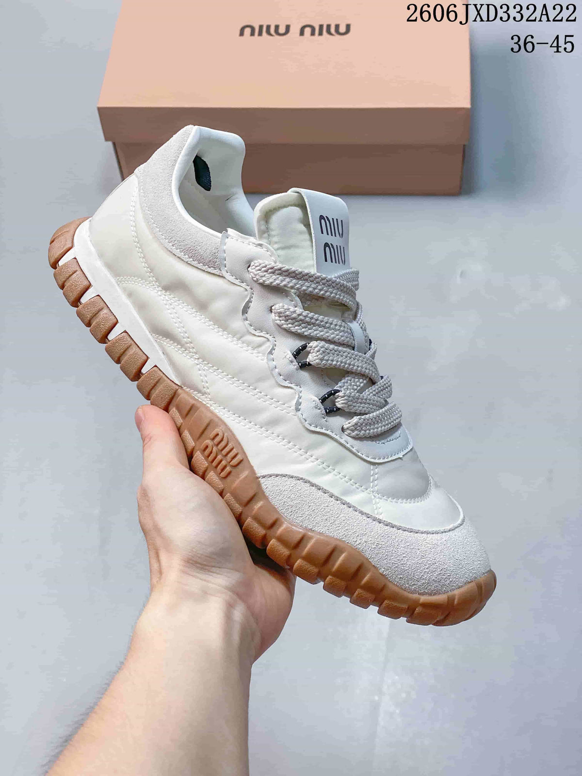 White Miu Miu Tyre low-top sneaker with light suede-look panels and gum-color outsole